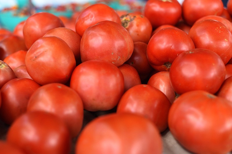 Staff photo by Matt Hamilton / If you have a bumper crop of tomatoes, like the Lucky Farm booth at Chattanooga Market in July, here are five recipes to try.