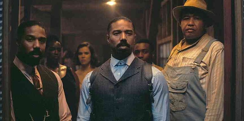This image released by Warner Bros Pictures shows Michael B. Jordan, foreground from left, Michael B. Jordan and Omar Benson Miller in a scene from