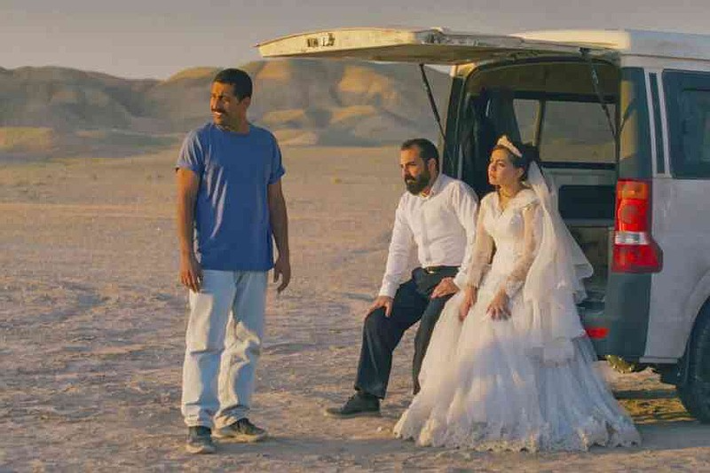 This image released by Neon shows, from left, Mohamad Ali Elyasmehr as Hamid, Majid Panahi as Ali, Hadis Pakbaten as Goli, in a scene from